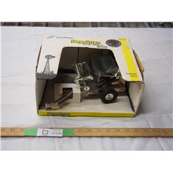 Degelman rock picker R570S silver anniversary model. Belt buckle included 1/16