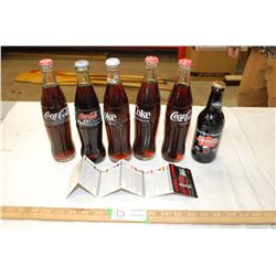6 Coke bottles some in 10 oz. size