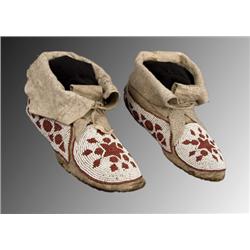 Cree beaded moccasins with high cuffs.