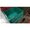 Image 2 : Stack of five green storage totes with built-in lids