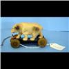 Image 1 : Celluloid Bear on Wheels Pull Toy Small celluloid bear on wheels with sting for a pull toy.  4" long