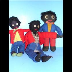 3 Early Golliwogs Group of three early golliwogs Measuring 11 , 13  and 12 .  Two wearing red vests 