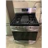 Image 1 : FRIGIDARE STAINLESS AND BLACK PROPANE STOVE