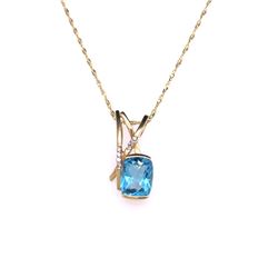 14Kt Gold 3.26 Tcw Blue Topaz & Natural Diamond Pendant.