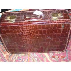 Brown leather suitcase with brass locks