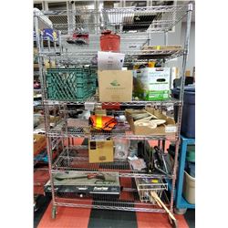 RACK OF UNCLAIMED MERCHANDISE. ALL PROCEEDS GO TO