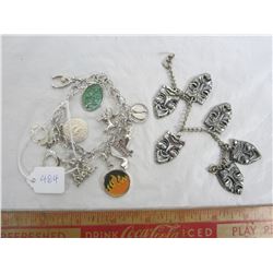 Lot of 2 charm bracelets the one on left is sterling most charms are marked one on right is not ster