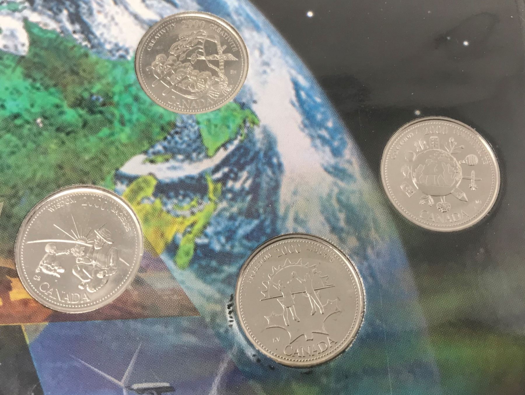 Complete set of 12 2000 Canadian Millennium 25 cents. All coins