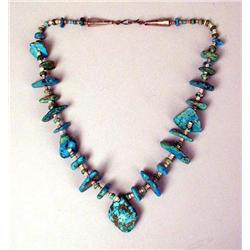 AN OLD NAVAJO SILVER AND TURQUOISE FLAT NUGGET NECKLACE