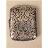 Image 2 : AN ELABORATELY ENGRAVED STERLING SILVER CIGARETTE CASE