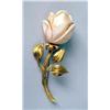 Image 1 : AN 18K YELLOW GOLD AND CARVED CORAL FLORA-FORM BROOCH