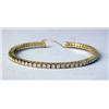 Image 1 : A YELLOW GOLD AND DIAMOND FLEXIBLE BANGLE BRACELET