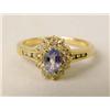 Image 1 : A 14K YELLOW GOLD DIAMOND AND TANZANITE RING