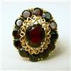 Image 2 : AN 18K YELLOW GOLD AND GARNET CLUSTER RING