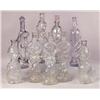 Image 1 : A GROUP OF COLORLESS GLASS FIGURAL BOTTLES