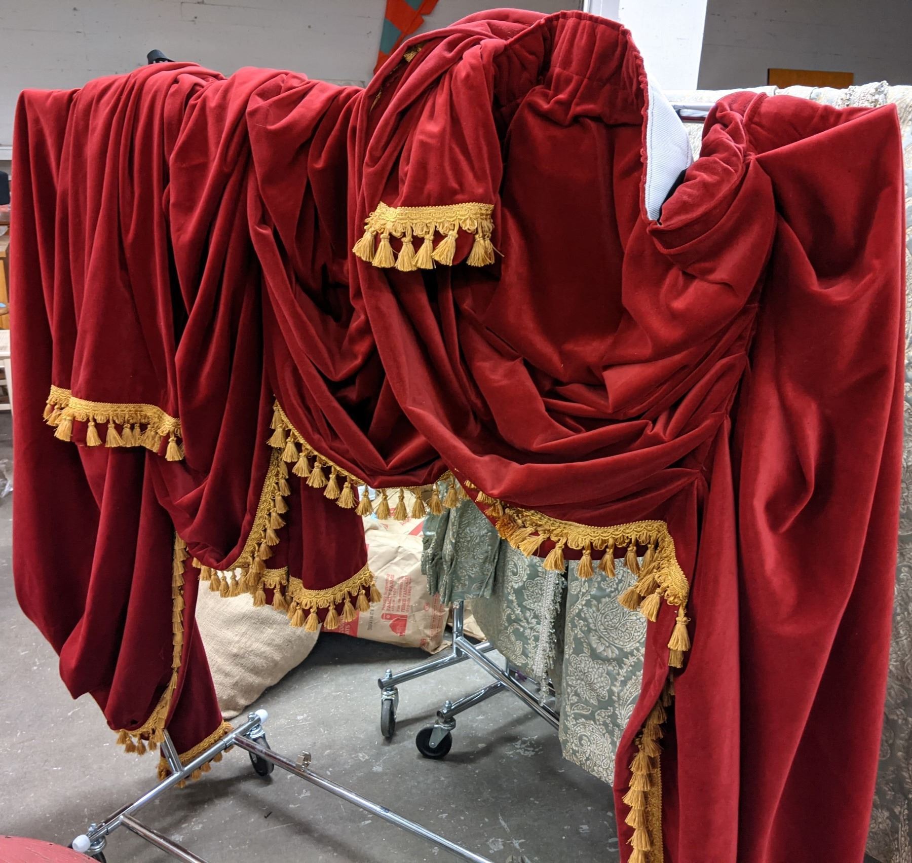 Rolling racks with red curtains