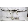Image 1 : GROUP OF THREE SILVER LONGHORN STATUES