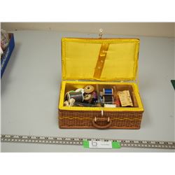 Wicker storage container with vintage sewing related items