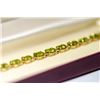 Image 1 : 14 KT GOLD AND PERIDOT BRACELET 7.5"