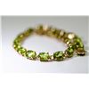 Image 2 : 14 KT GOLD AND PERIDOT BRACELET 7.5"