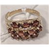 Image 1 : 10 KT GOLD RING WITH GARNETS
