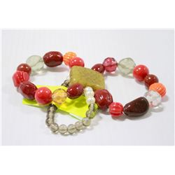 ASIAN BEADED BRACELET WITH CARVED JADE CENTRE