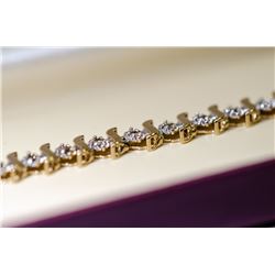 APPRAISED @ $2000.00 10KT YELLOW AND WHITE GOLD DIAMOND BRACELET.