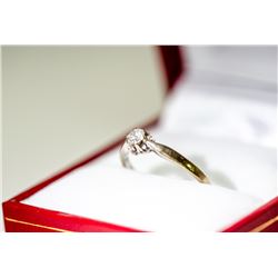 APPRAISED @ $800.00 18KT WHITE GOLD DIAMOND SOLITAIRE RING. SIZE 6