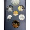 Image 2 : 1994 Royal Canadian Mint Year Set With Silver Dollar In Black Leather Book And Case