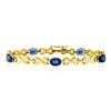 Image 1 : 14kt Yellow Gold 6.00 ctw Oval Iolite Puffed X & O Link Tennis Bracelet