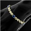 Image 2 : 14kt Yellow Gold 6.00 ctw Oval Iolite Puffed X & O Link Tennis Bracelet