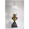 Image 1 : Antique oil lamp with cast "Kingfisher" motif base, brass front, dual burners, colourless chimney an