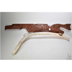 Caribou horn cribbage board 26" in length and a carved wall hanging and labelled on verso "Raven, Wi
