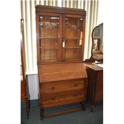 Antique English quarter cut oak fall front secretaire with fitted interior, two drawers and base and