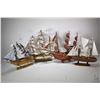Image 1 : Four wooden tall ships ranging in size from 15"-17", note these items are not available for shipping