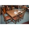 Image 1 : Mid 20th century walnut dining table with jack knife leaf and six matching chairs with upholstered s
