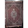Image 1 : 100% wool area carpet with center medallion, red background and overall geometric floral design with