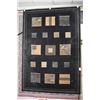 Image 1 : Wool area carpet with black background and earth toned geometric patchwork decoration, 63" X 90"