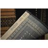 Image 3 : Wool area carpet with black background and earth toned geometric patchwork decoration, 63" X 90"