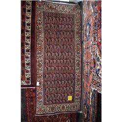 100% handmade wool carpet Borjloo with overall geometric designs and highlights of blue, cream, sage