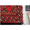 Image 2 : 100% handmade wool scatter rug with red background, geometric pattern and highlights of cream, blue 