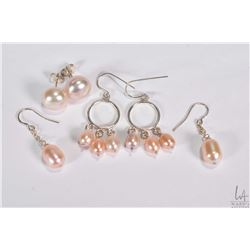 Three pairs of as new coloured pearl earrings including a studs and two with silver Shepard hooks