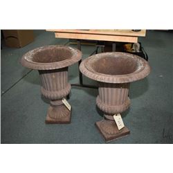 Pair of matching cast iron urn motif planters, 24" in height. Note: This lot cannot be shipped. Loca