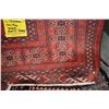 Image 2 : 100% handmade wool carpet runner Turkmen with red background, geometric design possibly architectura