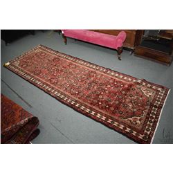 100% handmade wool carpet runner Hossien Abad with overall geometric design, red background and high