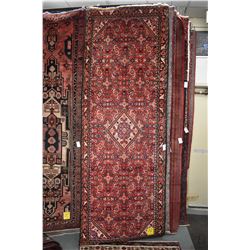 100% handmade wool carpet Hamdan with center medallion, red background and geometric floral, highlig