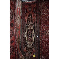 100% handmade wool carpet runner Hamdan with center medallion, red background and highlights of blac