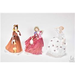 Three Royal Doulton figurines including Maureen HN2481, Autumn Breezes HN1934 and Julia HN2705