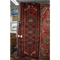 100% handmade wool carpet runner Savah with triple medallion, red background and highlights of blues