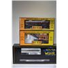 Image 1 : Three new in box O gauge train cars including two M.T.H Rail King; Pacific Great Eastern dump car wi